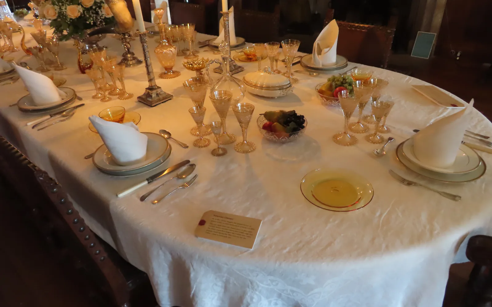 Formal dining table set with fine china and place settings at an event venue